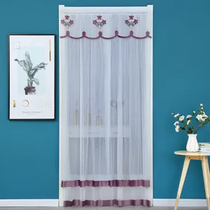 Detailed view of the sheer white door curtain featuring elegant purple floral embroidery and trim.