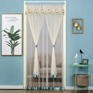 Detail view of the elegant double-layer lace mosquito door curtain in room decor.