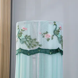 Vertical air conditioner cover detail, elegant peacock flower embroidery, light green mesh fabric.