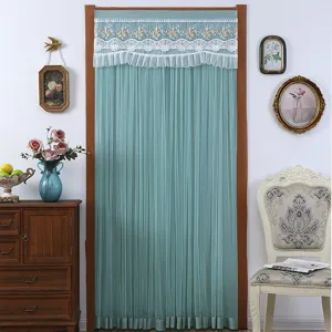 Detail view of the elegant green mesh door curtain with white lace embroidery for room decor.