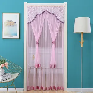 Pink mesh door curtain detail, featuring lace ruffle and purple tassel, elegant room decor.