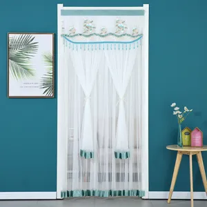 White double-layer lace embroidered door curtain with green trim and tassels for home decor.