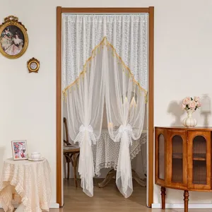 Elegant lace door curtain with gold trim and white bows for home partition decoration.