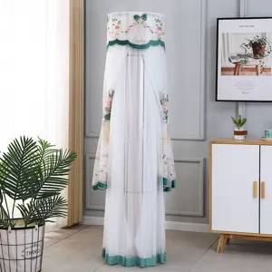 Vertical cylindrical air conditioner dust cover with delicate floral embroidery and green trim.