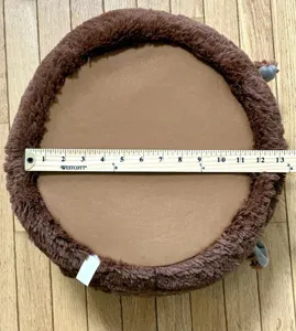 Close-up of brown plush Easter basket base showing 13-inch diameter measurement