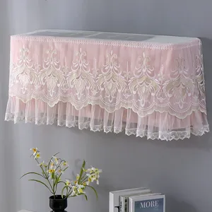 Pink lace air conditioner cover detail, elegant floral embroidery for home bedroom wall mount unit.