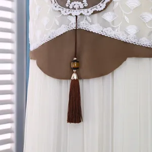 Detail view of vertical air conditioner cover with lace embroidery and elegant tassel pendant.