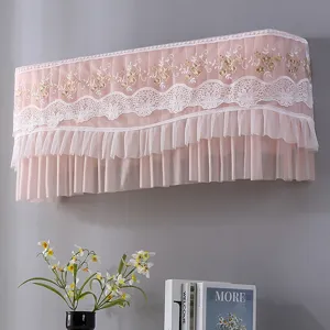 Pink lace air conditioner cover with floral embroidery and ruffle hem for home decor detail.