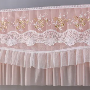 Detail shot of pink lace air conditioner cover featuring elegant embroidery and ruffles for home decor.