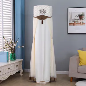 Elegant vertical cylinder air conditioner dust cover with lace embroidery and tassel fringe.