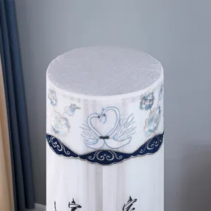 Vertical cylindrical air conditioner dust cover with elegant swan embroidery and white mesh fabric.