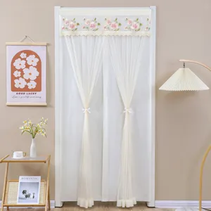 White lace door curtain with floral embroidery, elegant sheer partition for bedroom decor.