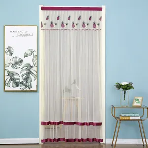 Detailed view of the mesh door curtain featuring embroidered pineapple patterns and purple borders.