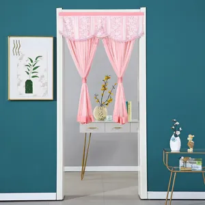 Detailed view of the elegant pink double-layer lace door curtain set in a cozy room decor.