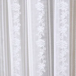 White lace sheer curtain detail view, delicate floral vine pattern texture, half window gauze.