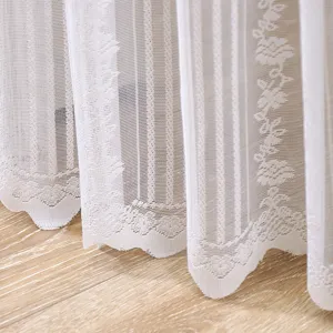 Detailed view of white lace sheer curtain with floral pattern and vertical stripes fabric.