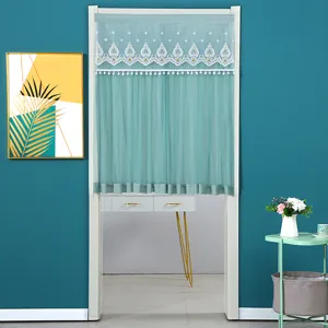 Detail view of the elegant green door curtain featuring delicate lace trim and soft mesh fabric.