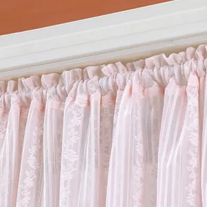 Pink lace short curtain detail, sheer fabric with floral design for bedroom decor.