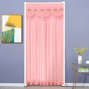 Pink door curtain detail, featuring delicate lace embroidery and hanging bead fringe design.