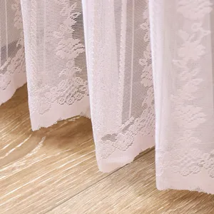 Pink lace curtain detail, soft sheer fabric with floral pattern for bedroom home decor.