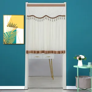 Detailed view of the decorative half curtain featuring sheer white fabric and elegant brown tassels.