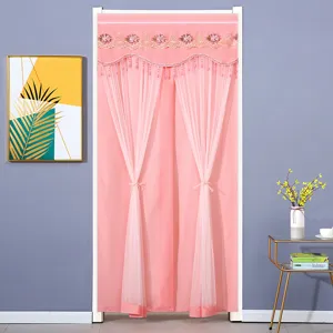 Detailed view of pink double-layer door curtain with elegant lace embroidery and hanging beads.