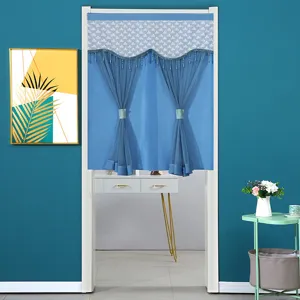 Detailed view of blue decorative door curtain with elegant lace top and beaded fringe for home.