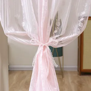 Pink lace half curtain detail, lightweight sheer fabric with elegant floral pattern and tie.