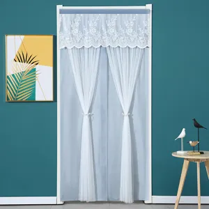 Detail view of the elegant lace top curtain and sheer door curtain in home setting.