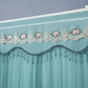 Teal door curtain detail, lace embroidery flowers, beaded tassels, double layer sheer mesh fabric.