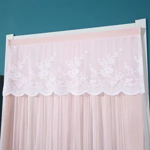 Pink door curtain detail featuring delicate white lace valance and sheer layered fabric.