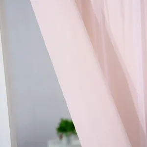 Close-up detail view of soft pink sheer fabric for door curtain and window privacy decor.