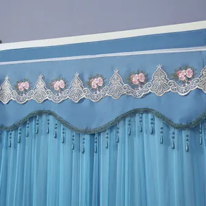 Blue double layer curtain detail, elegant floral embroidery and hanging bead tassels for room.