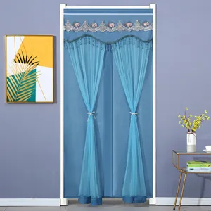 Double layer blue door curtain scene detail, lace embroidery and hanging bead fringe decor.