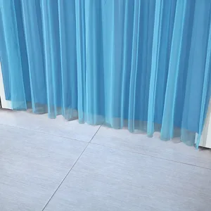Blue sheer door curtain detail, lightweight fabric with elegant drape, ideal for modern home decor.