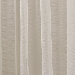 Detailed view of beige mesh fabric curtain material, soft texture and elegant vertical drape.