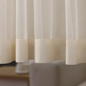 Detailed view of the sheer white curtain fabric showing fine mesh texture and neat hem.
