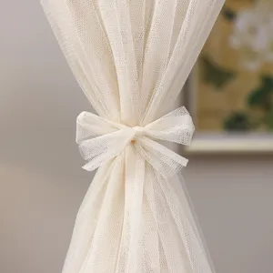 Beige sheer mesh door curtain with bow tie, punch-free privacy curtain for bedroom decor.