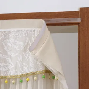 Door curtain detail shot featuring leaf lace pattern and colorful hanging beads decor.