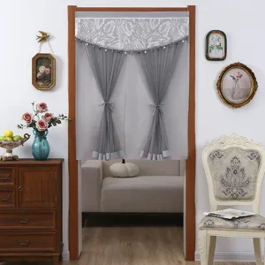 Grey lace door curtain with delicate floral embroidery, bead fringe and elegant tie backs for home.
