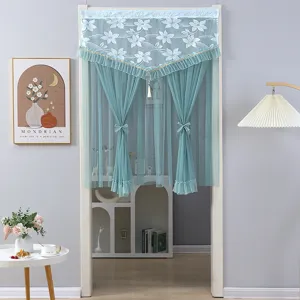 Detail view of the blue lace door curtain featuring elegant floral embroidery and ruffled edge design.