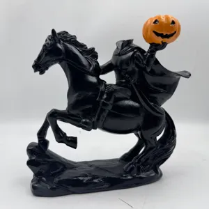 Detailed black headless horseman statue with orange pumpkin head for Halloween decor