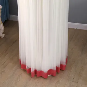 Detailed view of white mesh vertical air conditioner cover with red velvet bottom hem line.