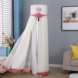 Detailed view of white mesh lace vertical air conditioner dust cover in living room.
