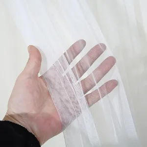 White sheer curtain fabric detail showing breathable mesh texture for home use close up