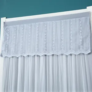 Detailed view of gray lace door curtain valance, floral embroidery and elegant scalloped edge.