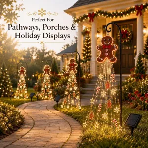 Solar gingerbread man pathway lights illuminating a garden path for holiday display.