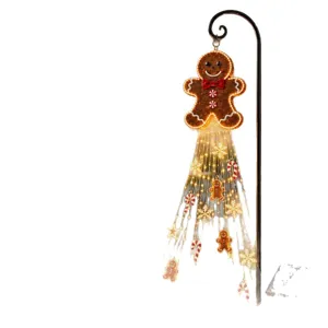 Solar powered gingerbread man pathway light with festive hanging LED string decorations
