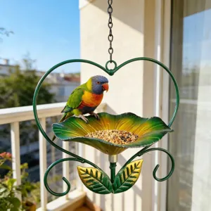 Close-up of heart-shaped flower bird feeder hanging on a balcony with a colorful bird