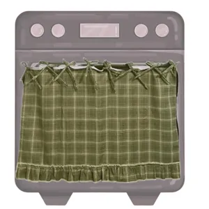 Détail d'une jupe de four faite main à carreaux vert olive avec des volants et des attaches